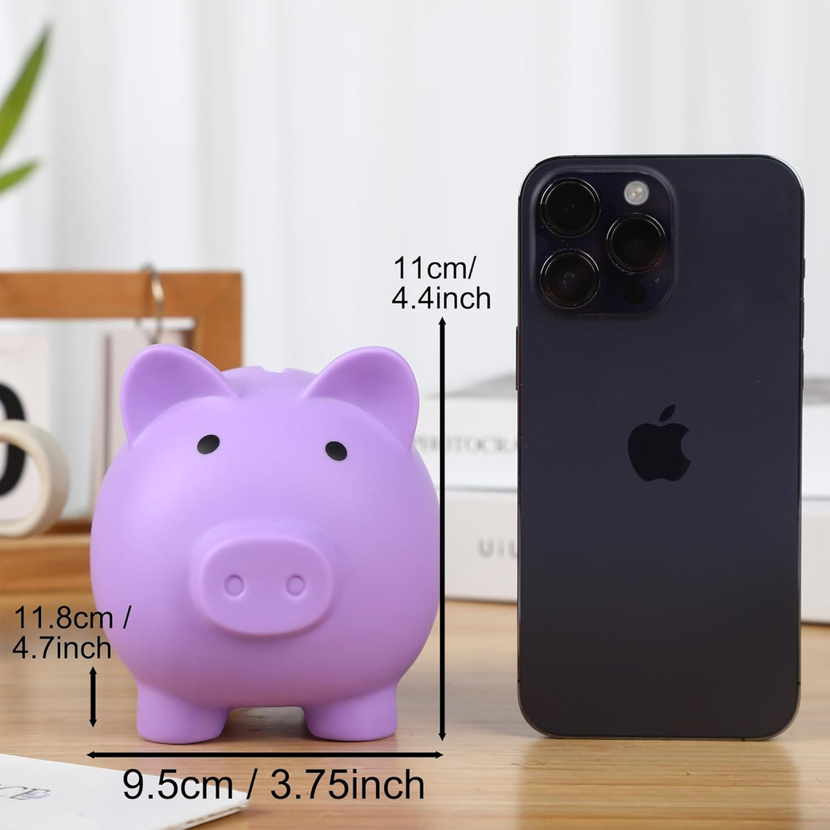 H&W small piggy bank held in hand showing scale