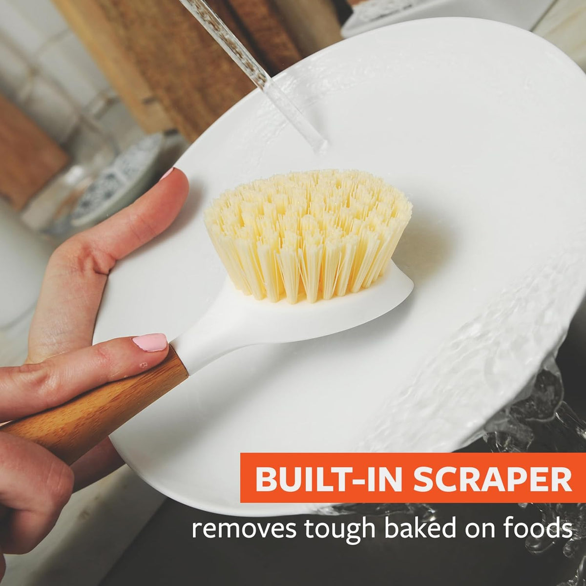 Full Circle kitchen brush highlighting the integrated food scraper.
