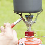 MSR backpacking stove igniter in hand