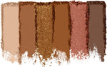 Cruelty free pressed powder palette being applied with a blending makeup brush