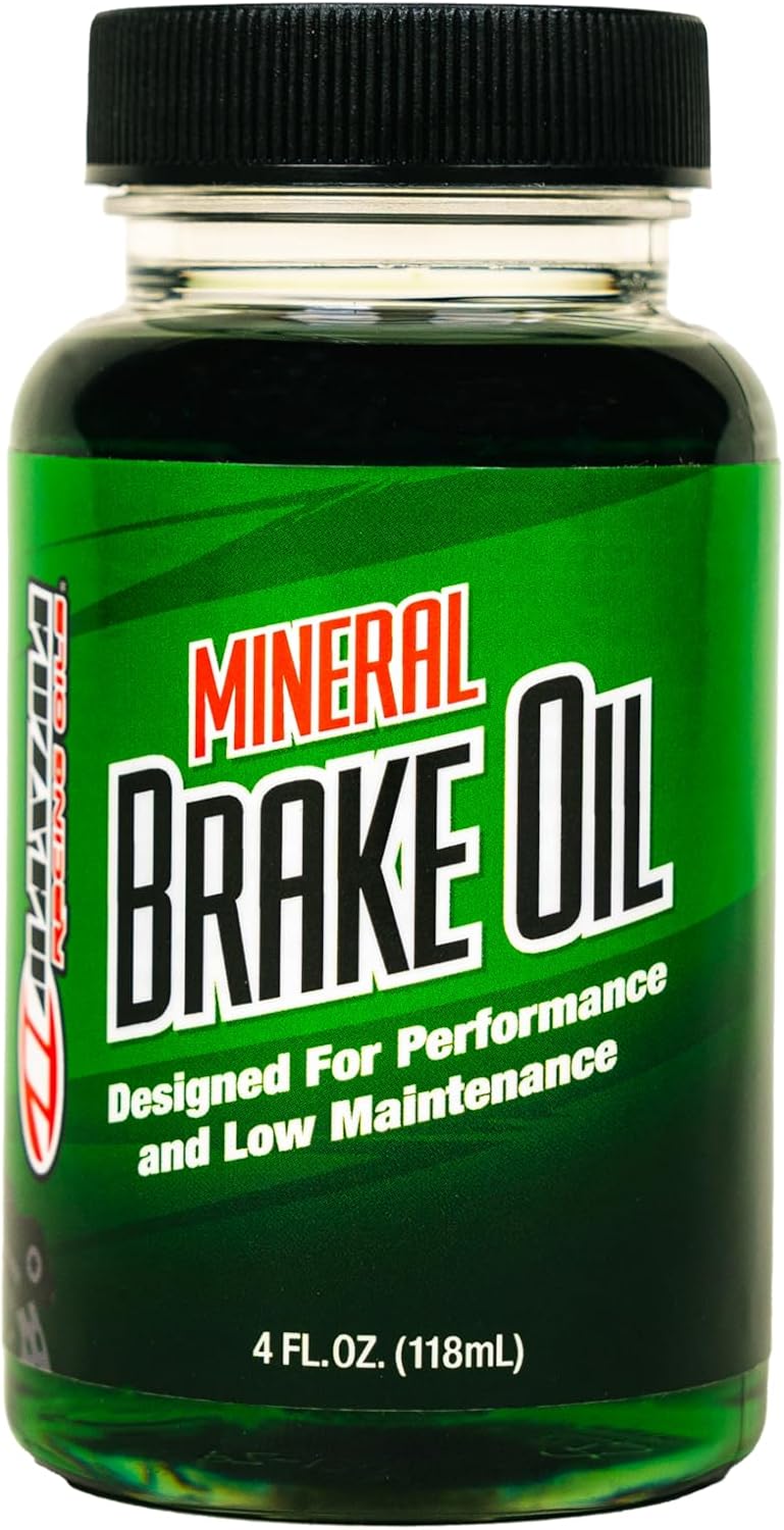 Maxima Mineral Brake Oil 4 Fluid Ounce bottle front view showing authentic product label and green hydraulic fluid type.
