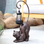 Hapyard solar powered cat statue styled in patio setting