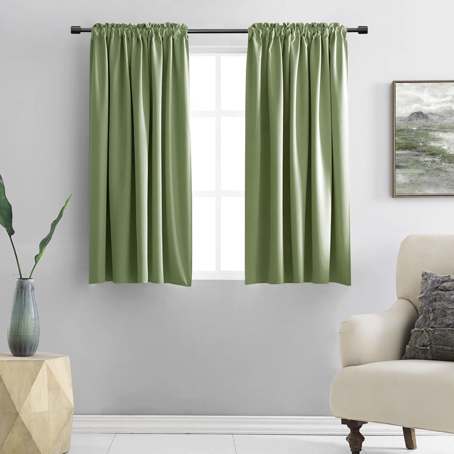 DONREN Sage Green Short Blackout Curtain Panels front view hanging on a window rod pocket style