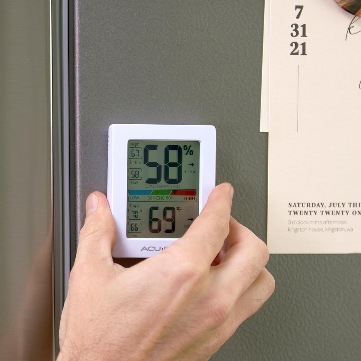 AcuRite temperature gauge displaying digital readings and trend arrows