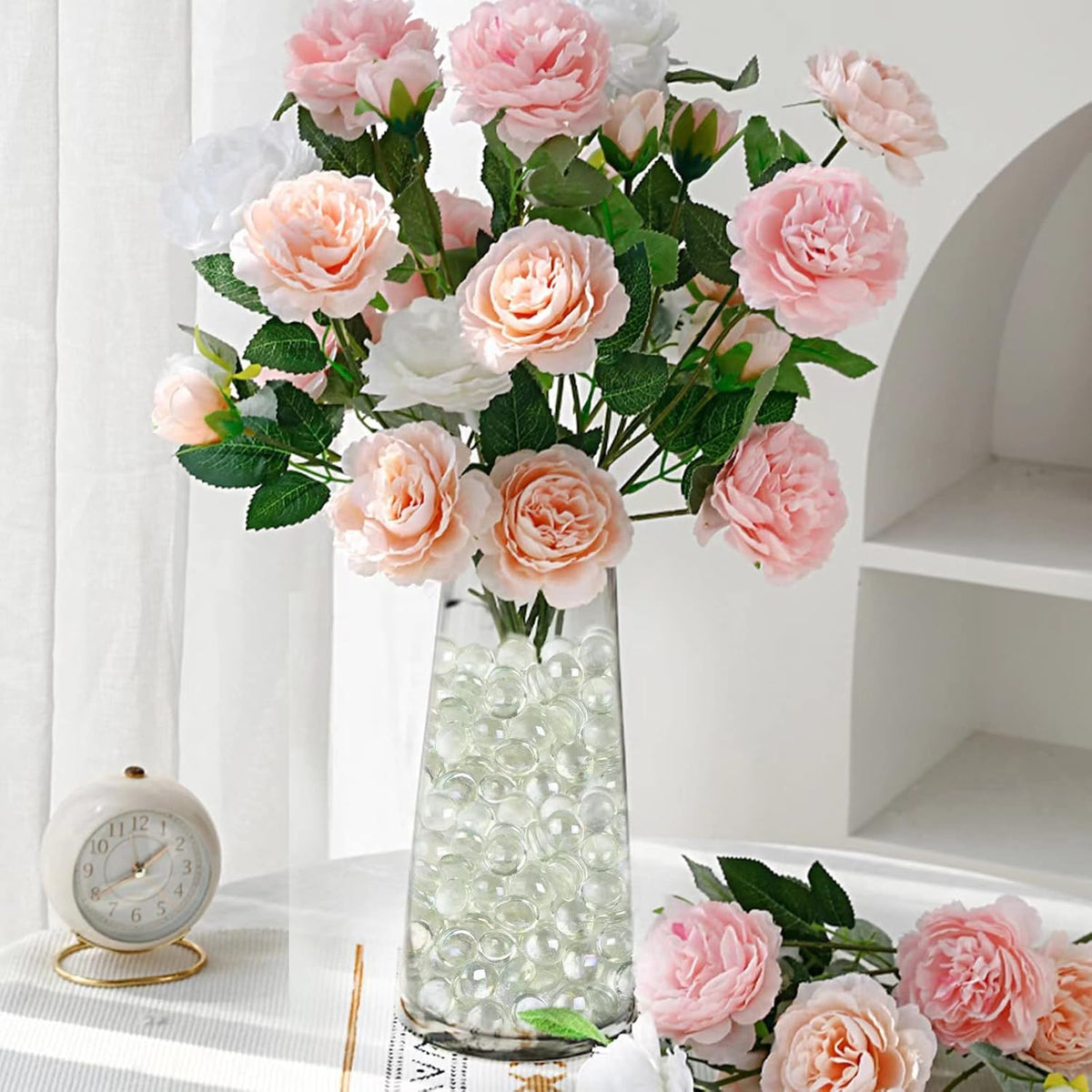 Clear flat glass stones arranged inside a decorative glass vase