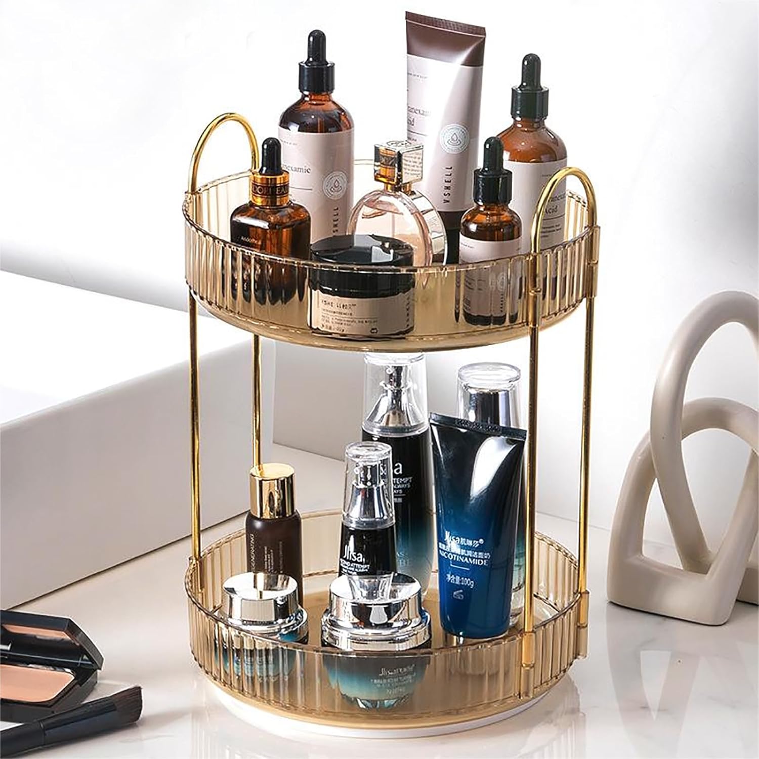 Zufudo rotating makeup organizer front view displaying luxury perfumes and skincare lotions on amber gold tiers