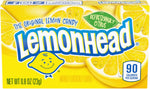 Close up of bright yellow Lemonhead hard candies