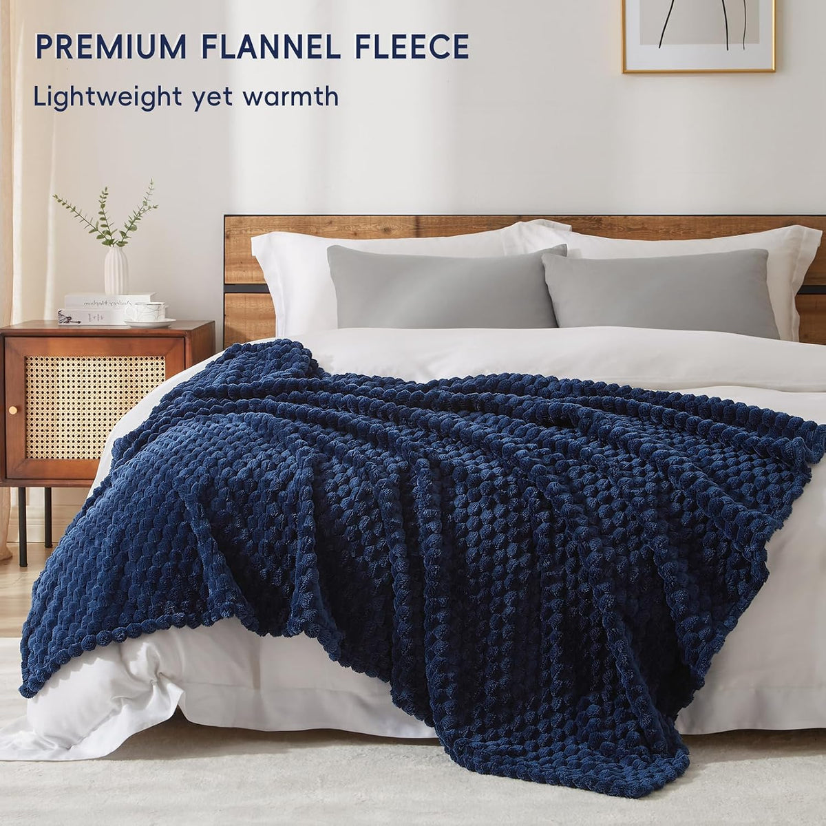 PHF navy blue throw blanket draped elegantly over a living room sofa