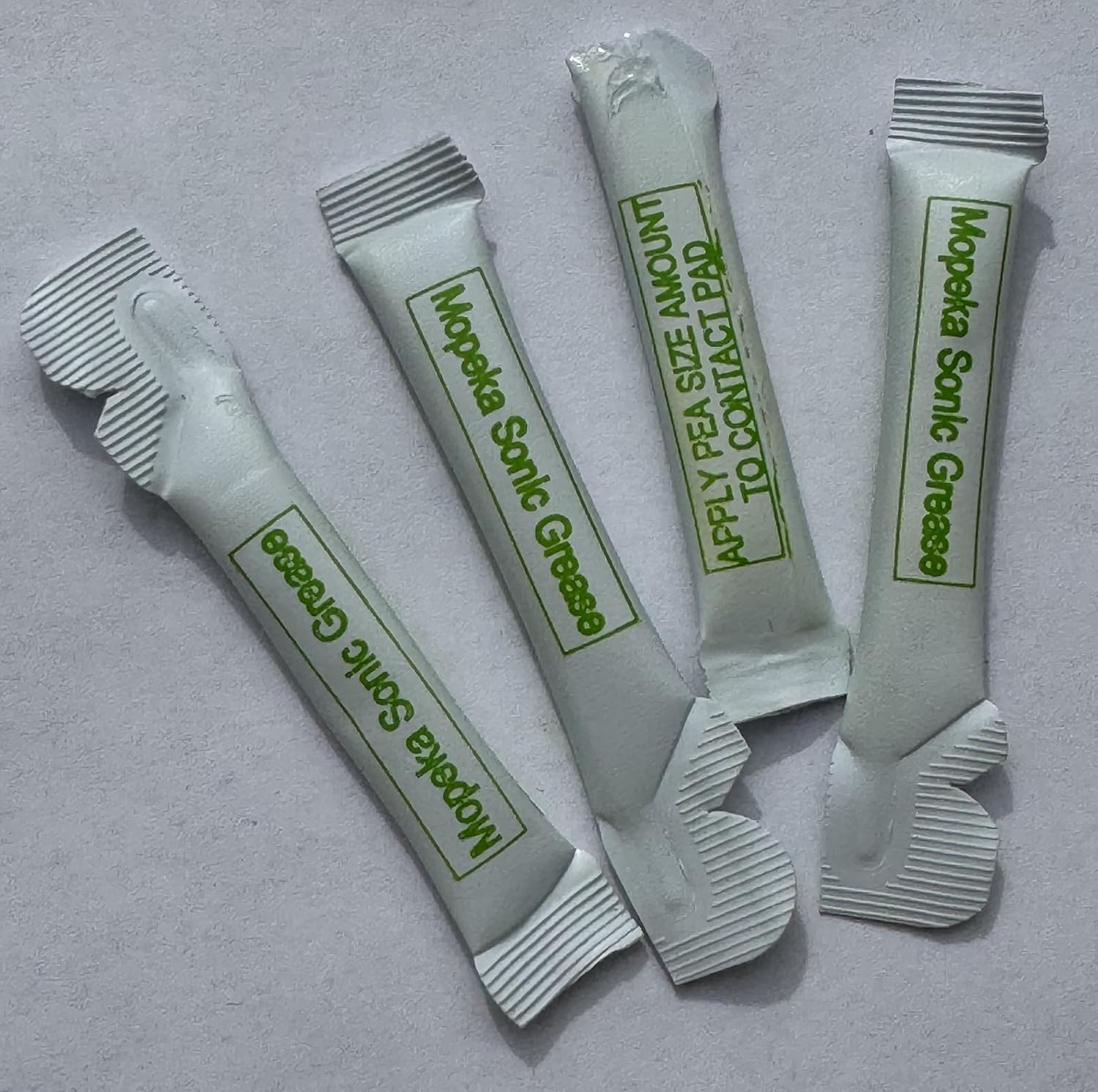 Mopeka sensor ultrasonic dielectric grease four pack front view showing single use packets