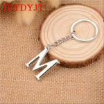 YJT silver initial keychain attached to car keys