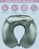 Bliss travel neck pillow in sage green with the matching sateen eye mask laid beside it.