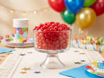 Decorative candy bowl filled with red jumbo jelly beans