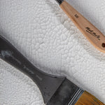 Crackle paste applied on wooden surface craft project