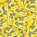 Close up of yellow banana chewy taffy candy wrapper detail and texture