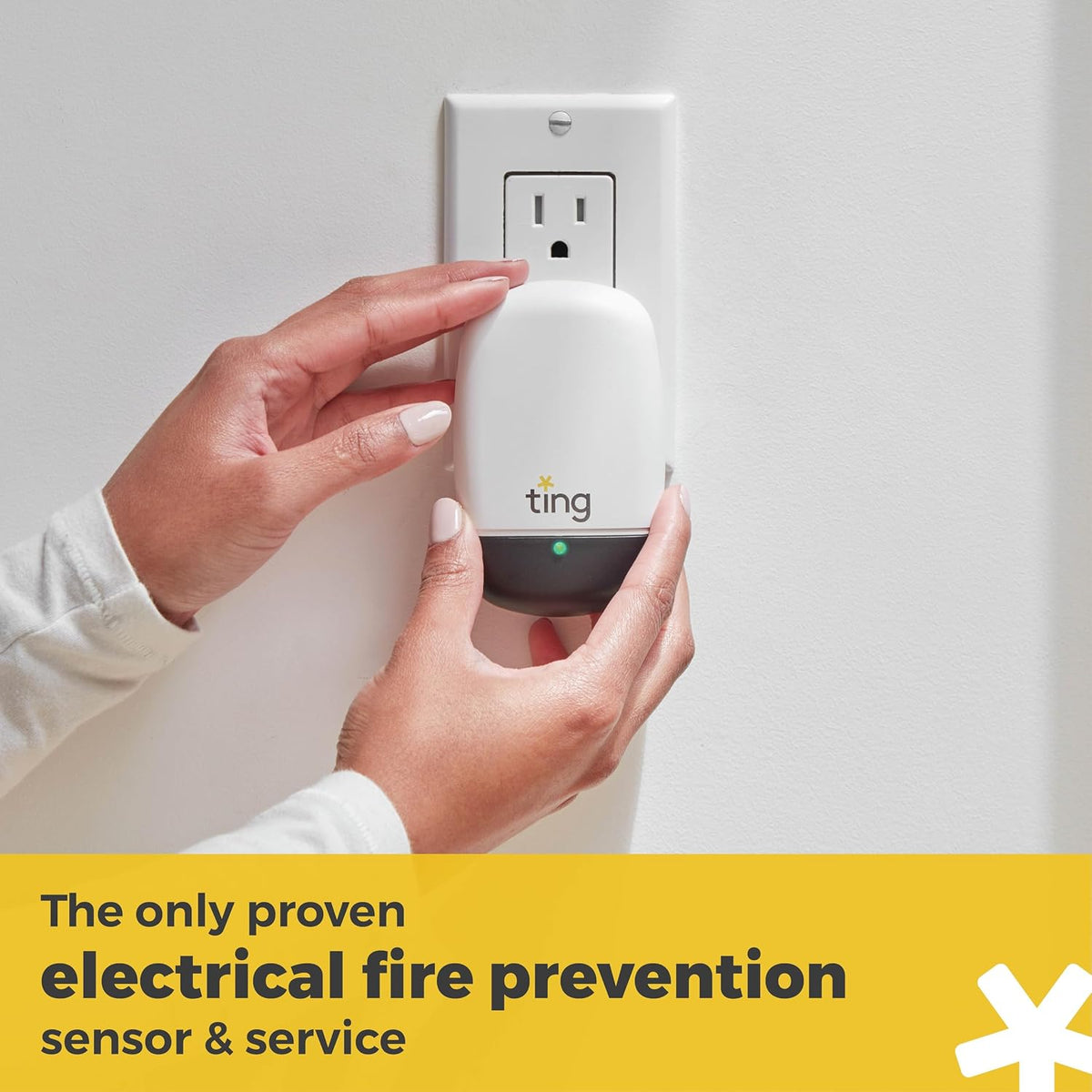 Ting Fire sensor plugged into a wall outlet