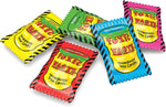 Toxic Waste hazardously sour fruit flavors candy bag held up showing its true imported size