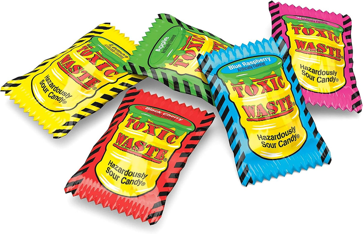 Toxic Waste hazardously sour fruit flavors candy bag held up showing its true imported size