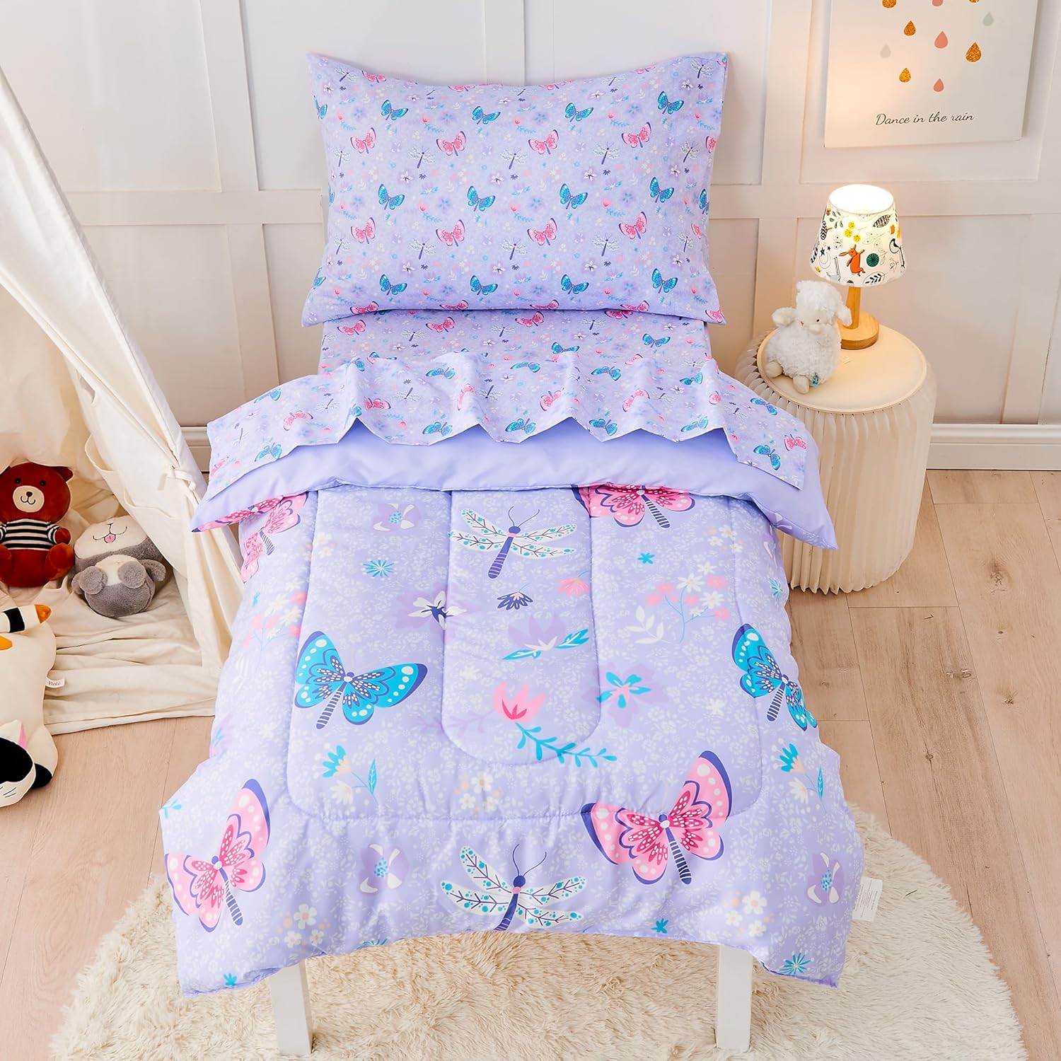Lasoftan butterfly toddler bedding set front view of fully assembled purple comforter and sheets on a kids bed.