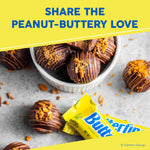 Crushed Butterfinger candy bar pieces used as a dessert topping on ice cream