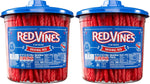 Close up view of the authentic soft and chewy red licorice candy twists texture inside the container.