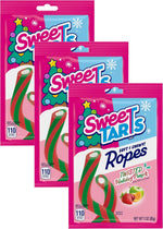 SweeTARTS mini candy canes used as colorful decorations for gingerbread houses