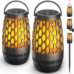 Hesontec outdoor bluetooth speaker front view showing flickering LED flame light effect on a patio table.