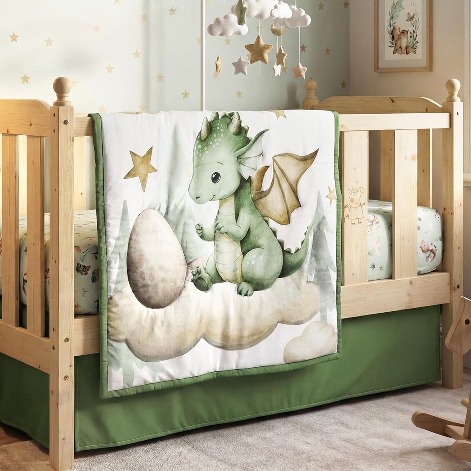 Peryiter 3 piece watercolor dragon crib bedding set front view showcasing the mint green dragon quilt layered on a standard crib mattress.