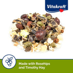 Close-up of corn-free small animal treat with timothy hay pellets and mountain ash berries.