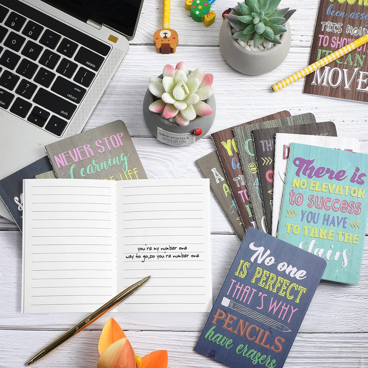 Outus inspirational notepads opened to blank writing pages