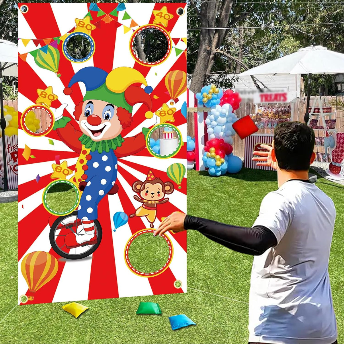 Toniful carnival toss game banner with clown design front view