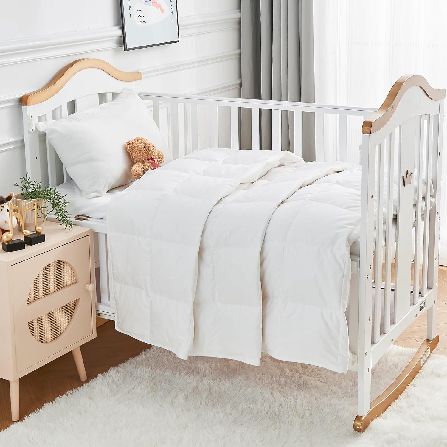 Rose Feather toddler goose down comforter front view showcasing the premium quilted box stitching on the white nursery blanket.