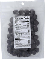 Organic roasted coffee beans covered in rich dark chocolate candy close up.