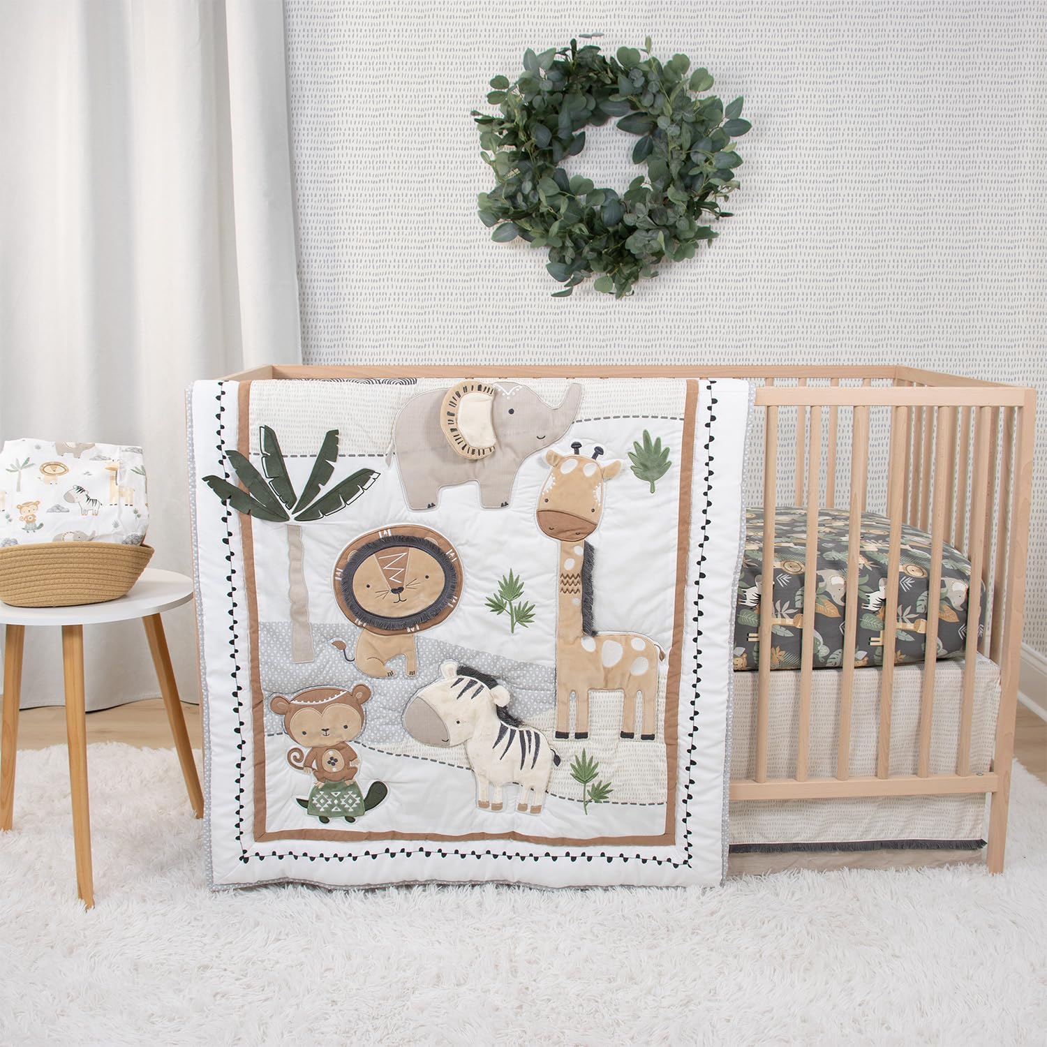 The Peanutshell Safari Serenity 4 piece organic cotton crib bedding set front view showcasing the neutral animal quilt