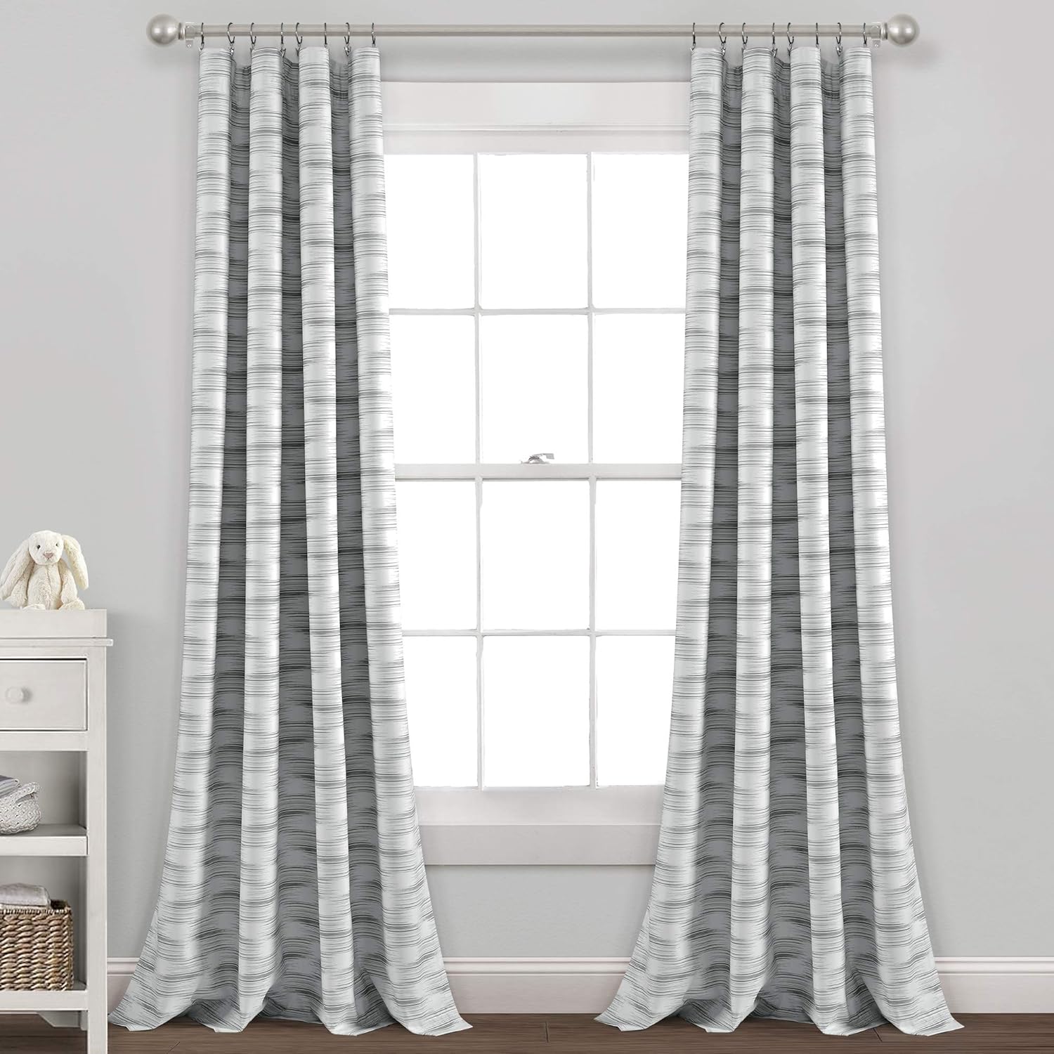 Lush Decor Baby Jungle Adventure Geo Blackout Window Curtain front view in a modern nursery setting.