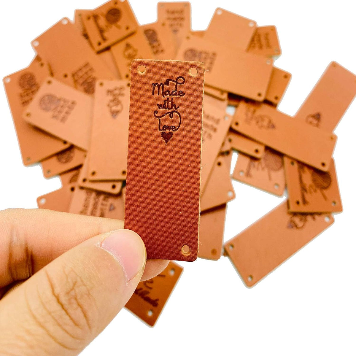 Close up of pre-punched holes on folding leather labels