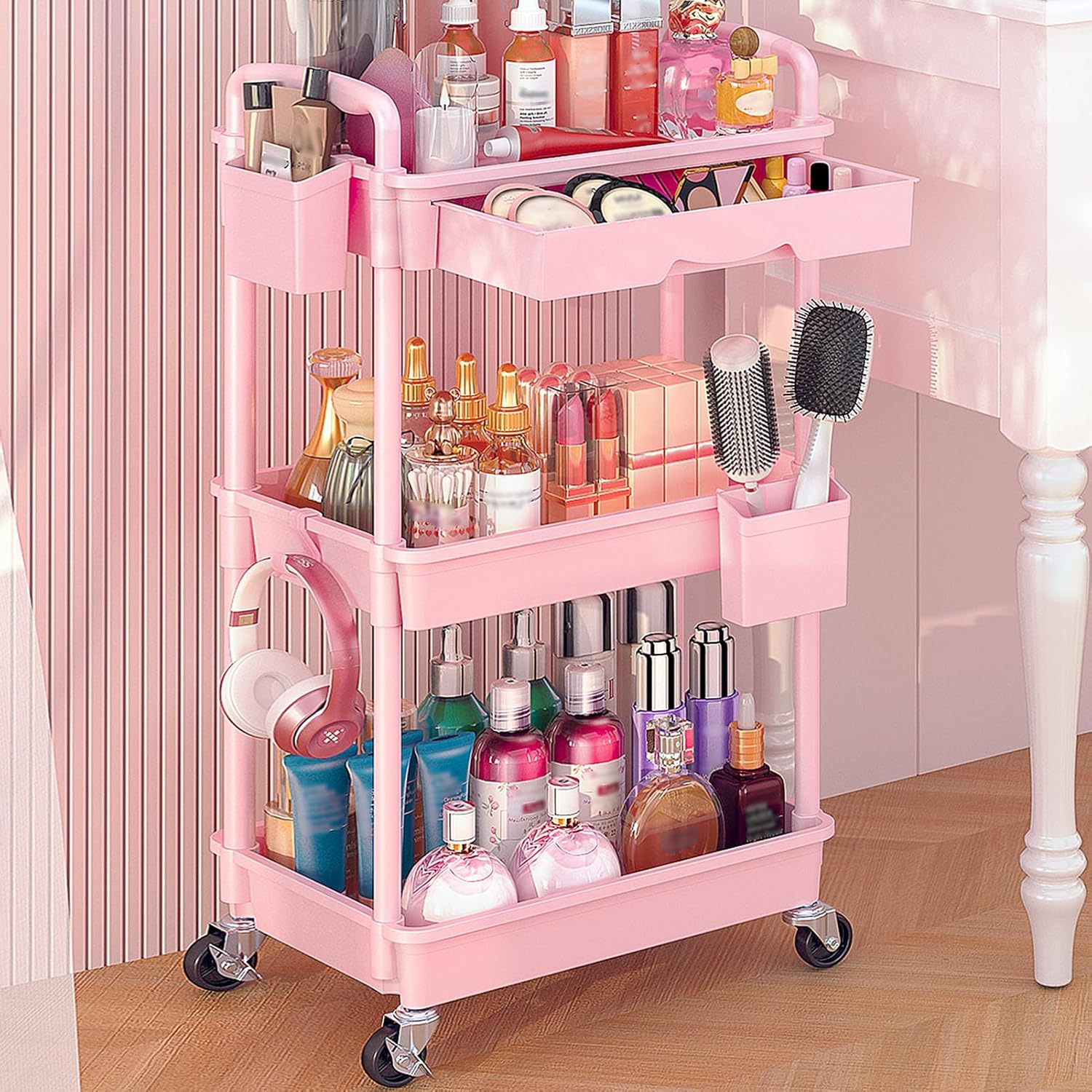 Goovilla rolling makeup organizer cart front view in vibrant pink color with three storage tiers.