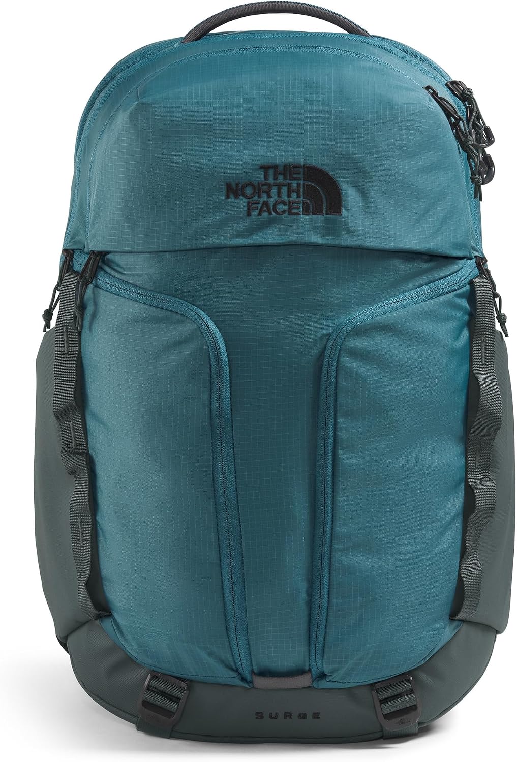 The North Face Surge commuter backpack reflective details in low light