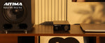 Complete packaging contents of AIYIMA A07 including the mini amp, manual, and thirty two volt power brick.