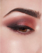 Milani imported eyeshadow palette showing 9 warm neutral mattes and 3 vibrant shimmer colors.