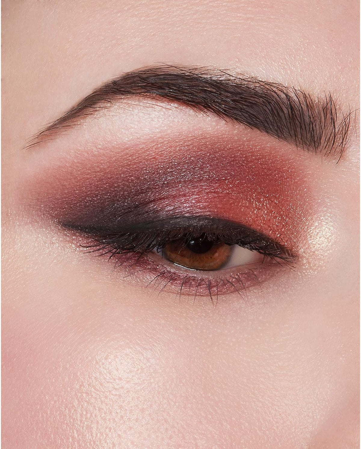 Milani imported eyeshadow palette showing 9 warm neutral mattes and 3 vibrant shimmer colors.