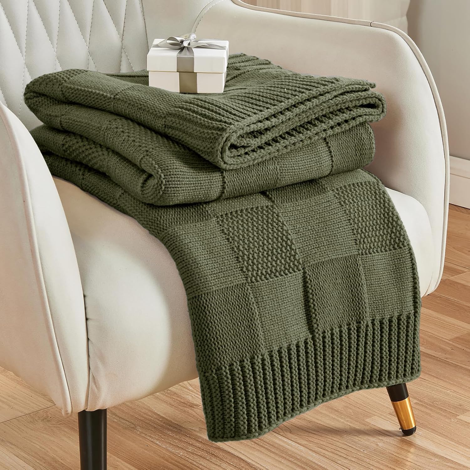 CozeCube Olive Green Checkered Knit Throw Blanket on a beige couch