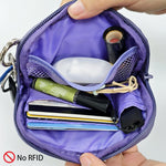 Ikokei small travel clutch showing wrist strap attachment
