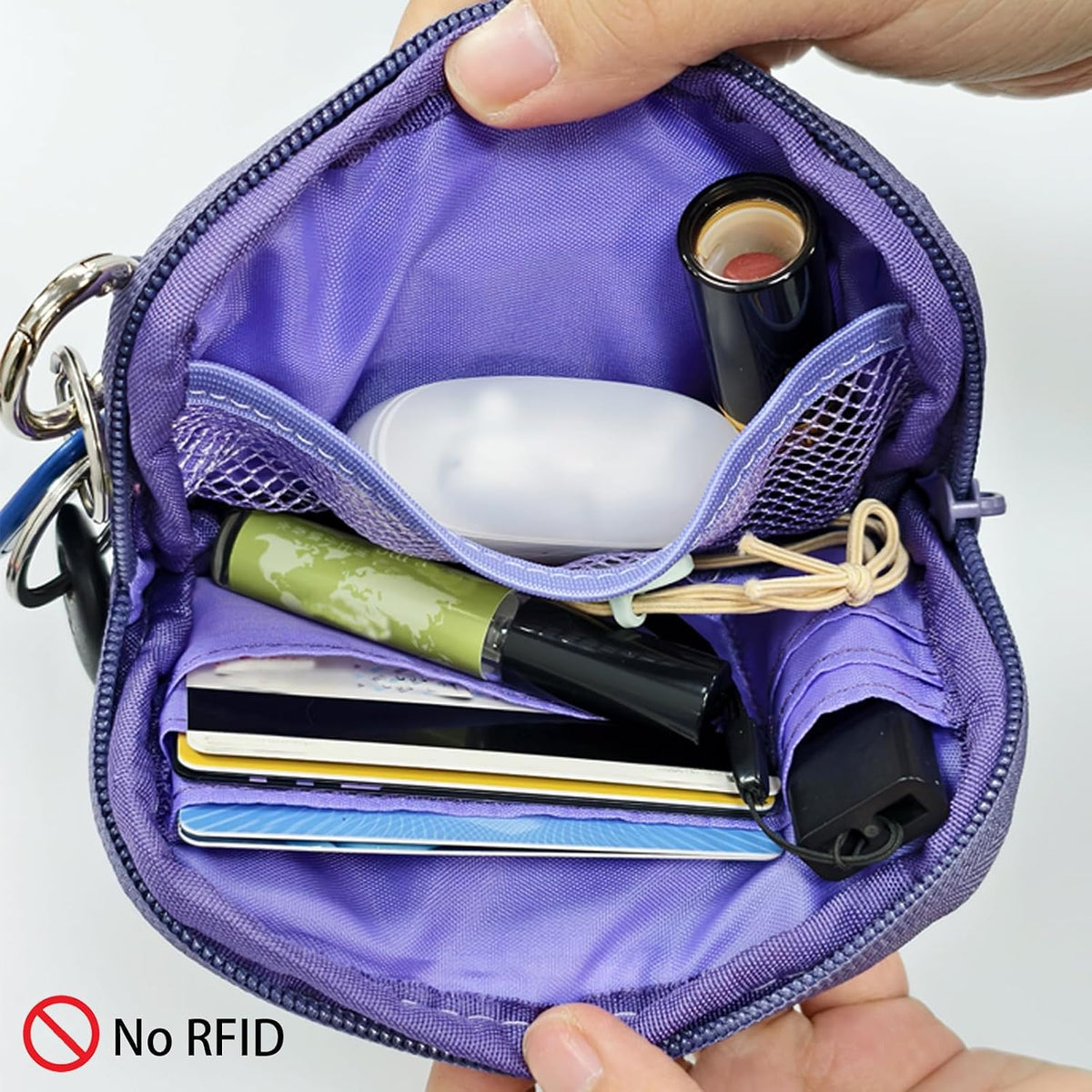 Ikokei small travel clutch showing wrist strap attachment