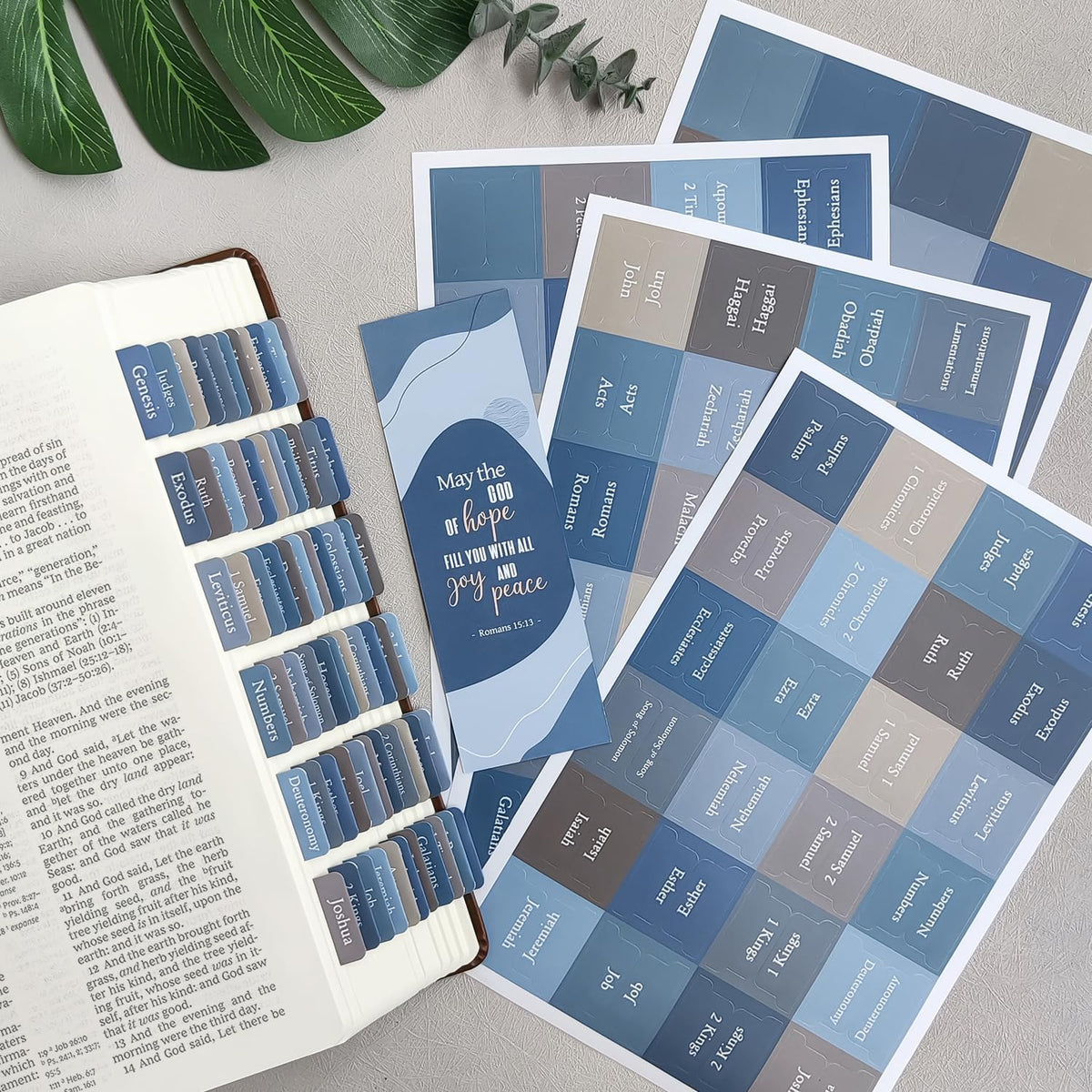 Uzriyl blue Bible book index tabs attached to pages