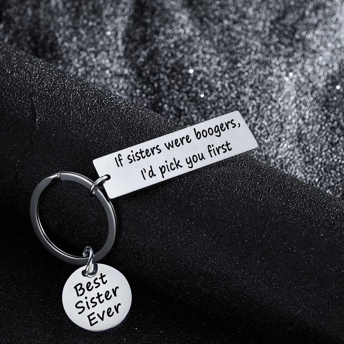 Close up shot of the stainless steel rectangular charm with humorous typography.