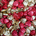 Individually wrapped red and gold foil chocolate peanut butter heart treats spread out