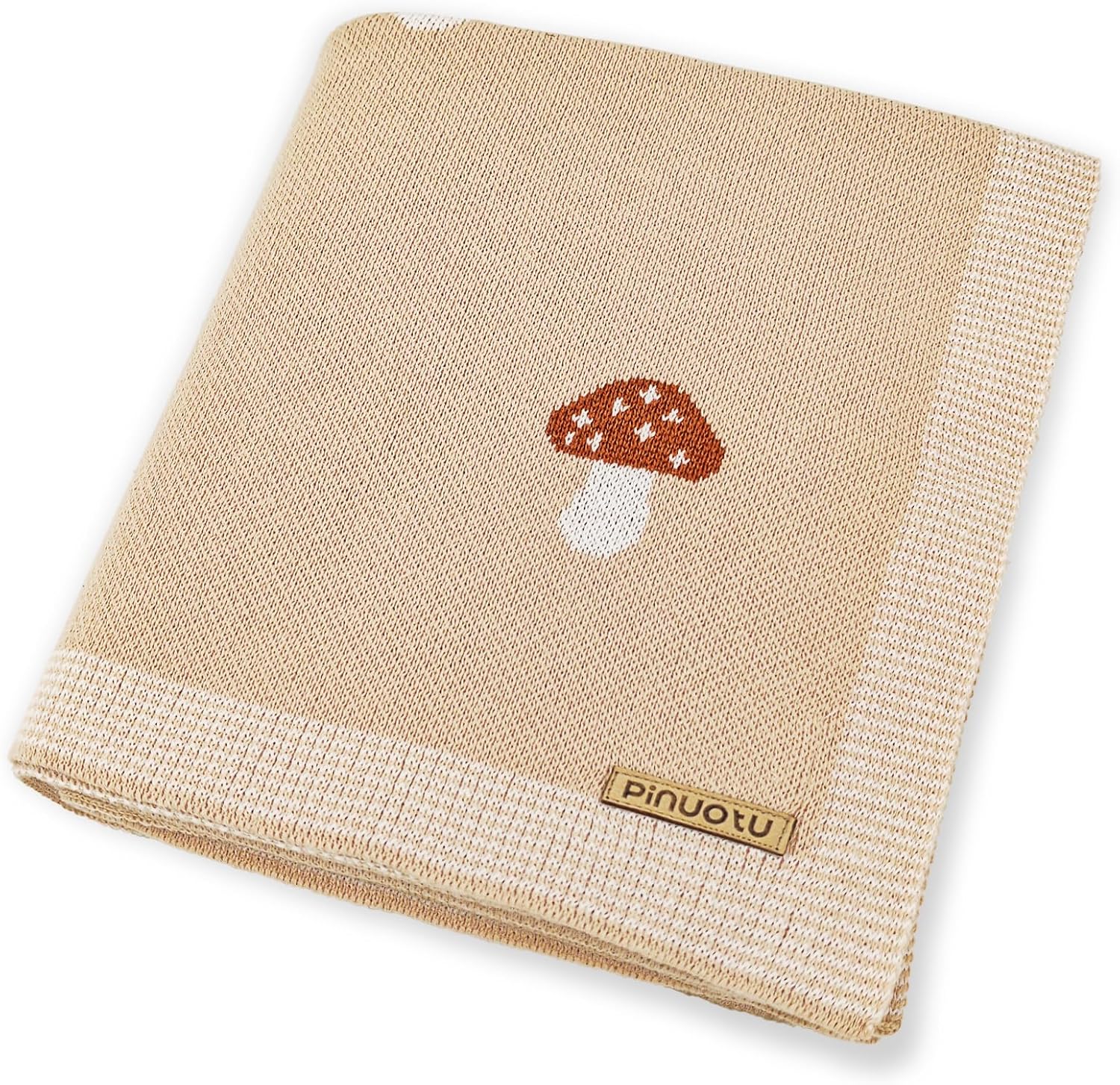 Pinuotu mushroom baby blanket front view showing premium cream cotton knit texture.