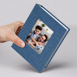 Vienrose small photo album 4x6 front view showing blue linen texture and round photo window.