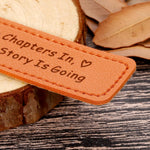 Lifestyle view of leather bookmark placed inside an open book