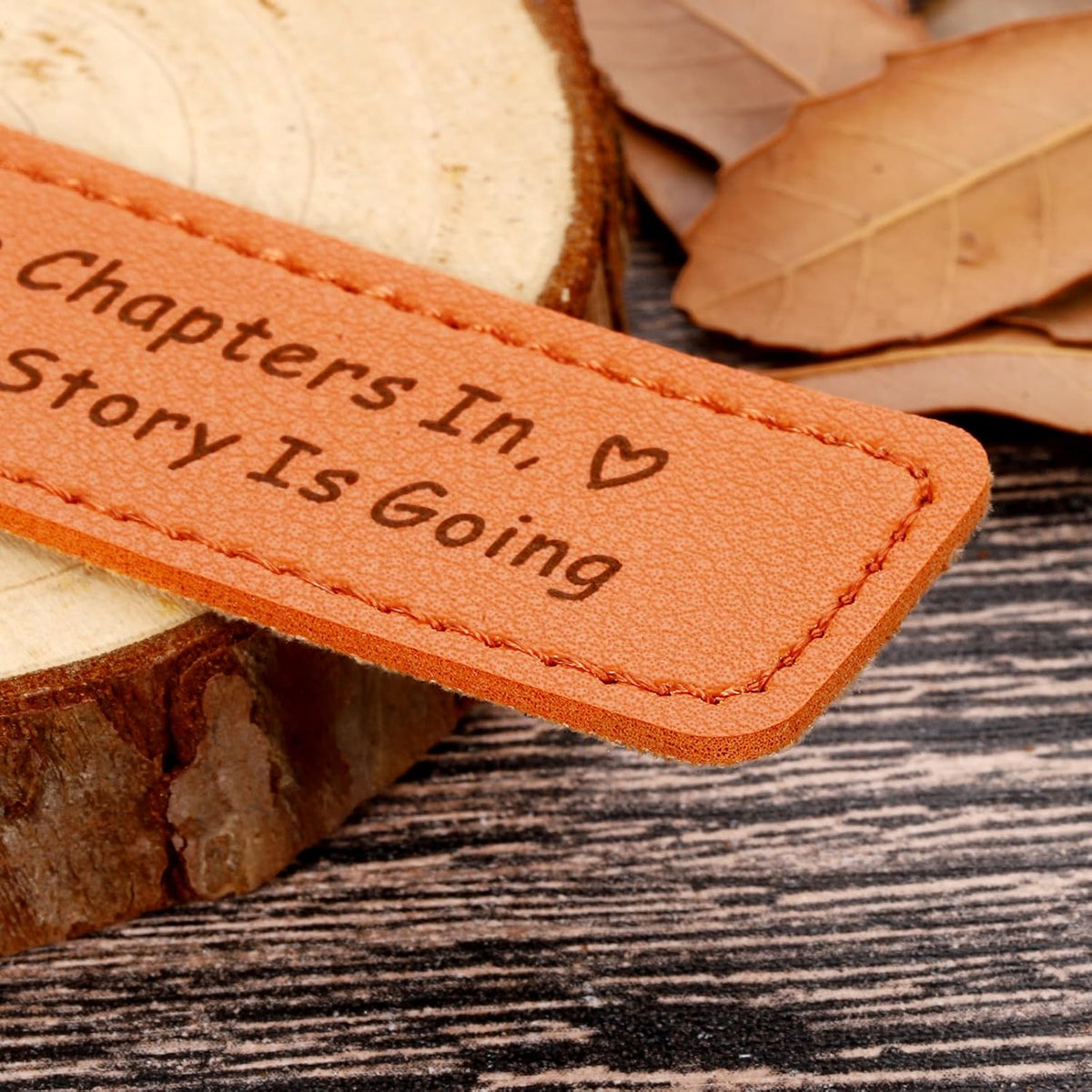 Lifestyle view of leather bookmark placed inside an open book